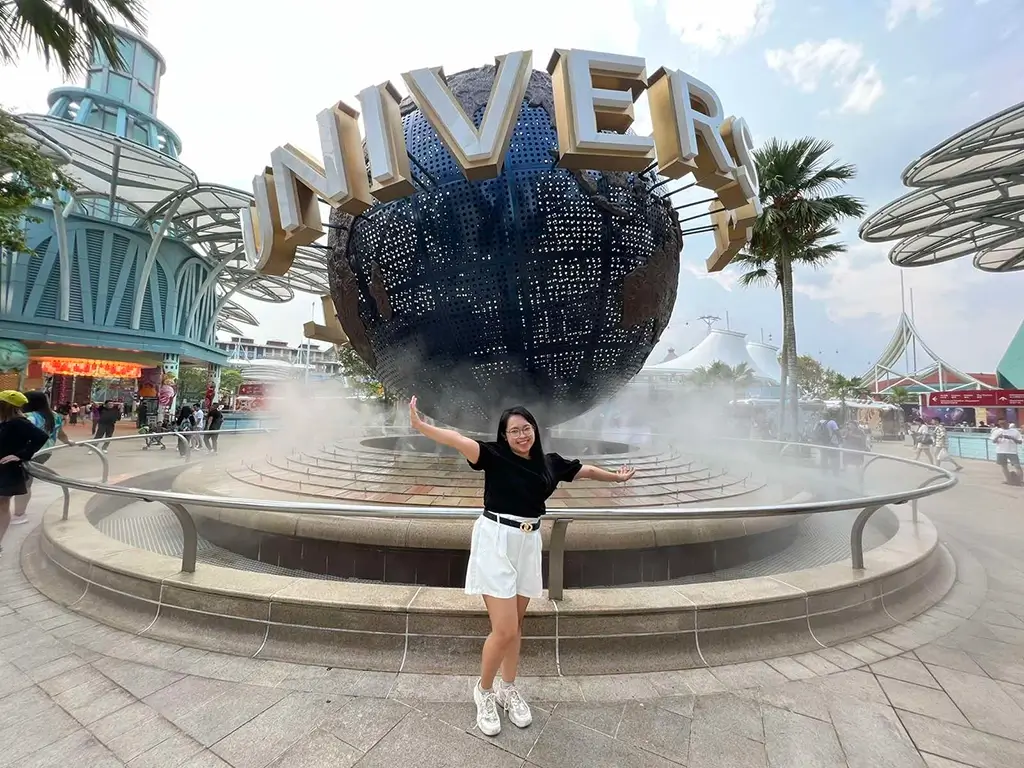 Charie posing in front of the Universal Studios giant glove at Sentosa Island, Singapore