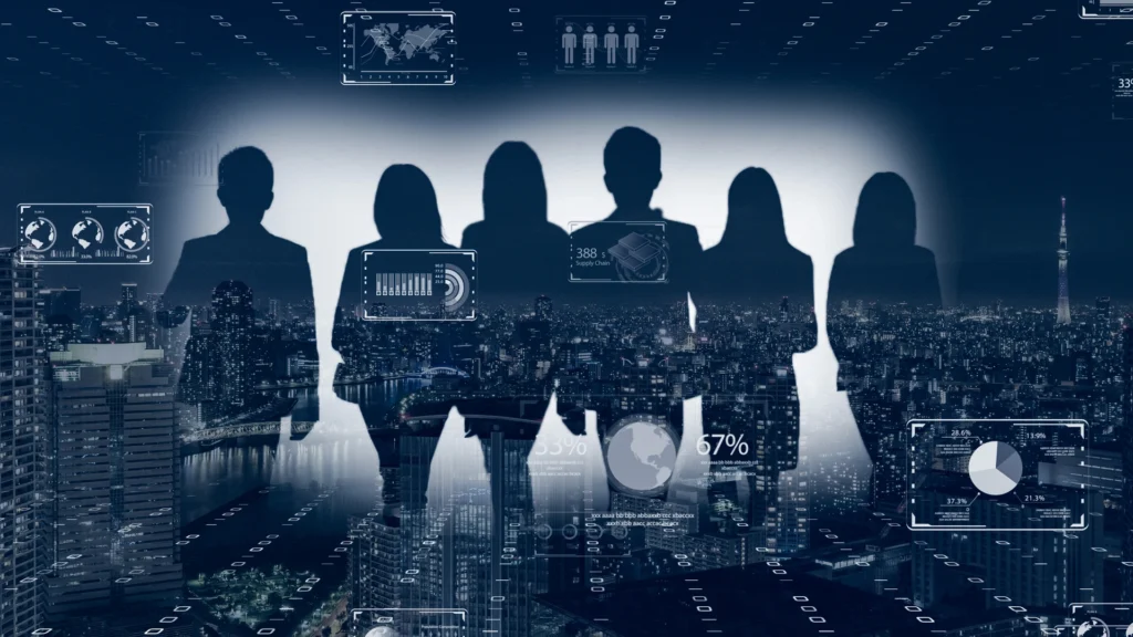 Silhouettes of six individuals stand against a night city skyline, with digital data overlays and graphs illuminating the scene. The image represents a blend of technology and teamwork.