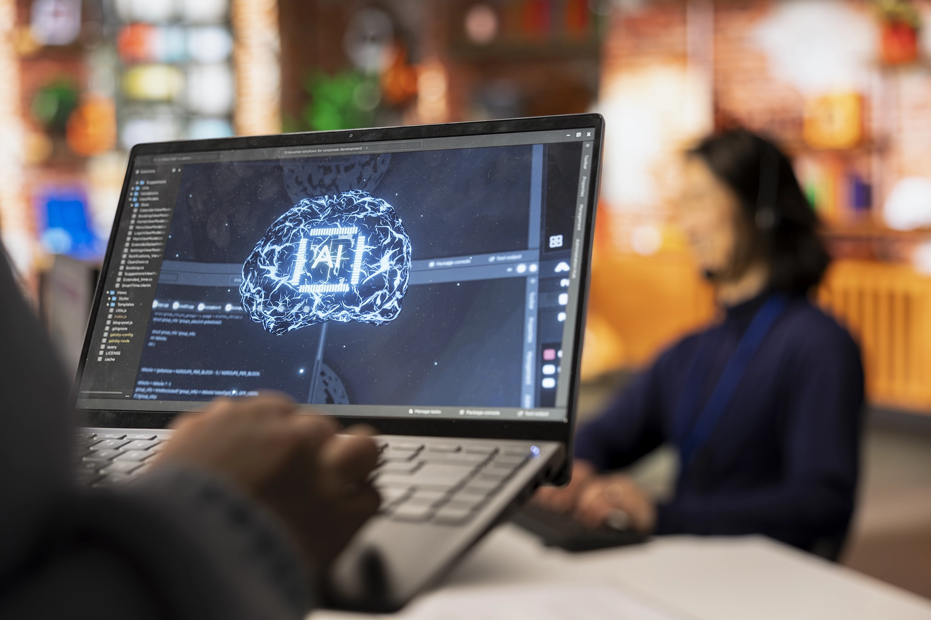 Individual working on a laptop with a graphic showcasing Visual Agentic AI Tools.
