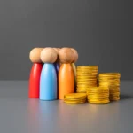 Wooden figures beside stacks of gold coins symbolizing the battle between banks, tech firms, and regulators over stablecoin regulation and control of digital dollar reserves.